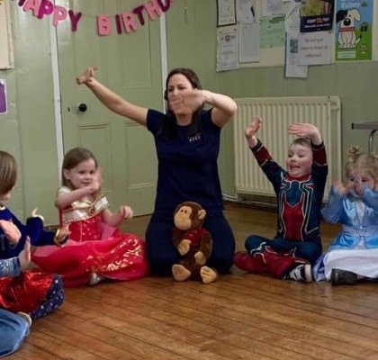 children joining in at a party