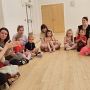 Children sat in circle taking part in activity