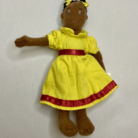 Dolly finger puppet. doll wearing a yellow dress