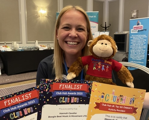 Hannah and Giggles the Monkey with their Club Hub Awards