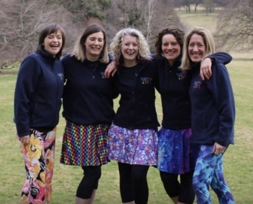 5 ladies wearing Boogie Beat clothing with arms around each other