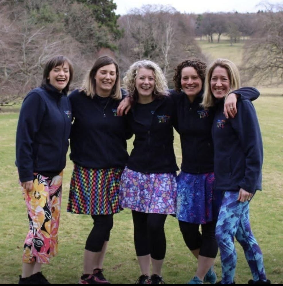 5 ladies wearing Boogie Beat clothing with arms around each other